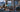 AI-generated cutaway illustration of a Hong Kong apartment with a main router, Mesh node and laptop; conceptual coverage, not measured Wi-Fi performance.