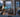 AI-generated cutaway illustration of a Hong Kong apartment with a main router, Mesh node and laptop; conceptual coverage, not measured Wi-Fi performance.