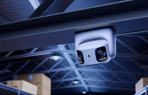 Reolink RP-PCT8MD dual-lens camera mounted under a warehouse roof beam