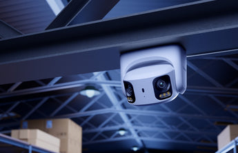 Reolink RP-PCT8MD dual-lens camera mounted under a warehouse roof beam