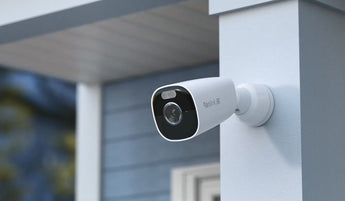 White Reolink 4K battery camera mounted on a porch pillar