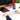 Hands typing on the silver GK08 keyboard in front of a monitor