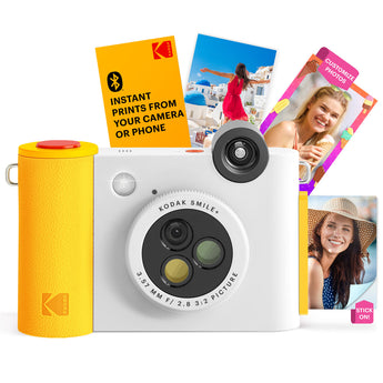 White Kodak Smile+ with yellow grip, red shutter button and sample prints behind it
