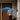 Man walking up to a wooden front door with the EP4 camera's detection zone shown in blue