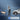 Detection boxes around a dog, a person and a car with a person alert notification
