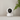 EZVIZ H6C Pro on a white shelf against a grey wall with a fern leaf