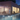 Evening poolside terrace with a man walking inside a tracking frame