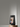 EZVIZ S10 on a round wooden stand showing a video call with an older couple on screen