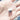 White USB-C nano receiver held in the palm of a hand